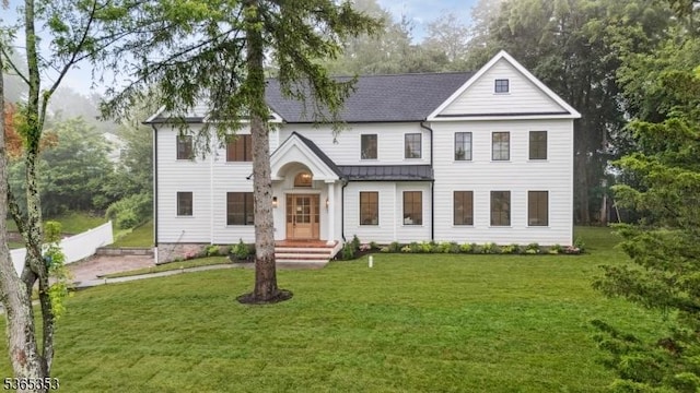 338 Old Short Hills Rd, Millburn Twp, NJ 07078 - view of front of home featuring a front yard, a standing seam roof, a metal roof, and roof with shingles