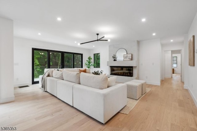 338 Old Short Hills Rd, Millburn Twp, NJ 07078 - living room featuring light wood-type flooring, recessed lighting, and a fireplace