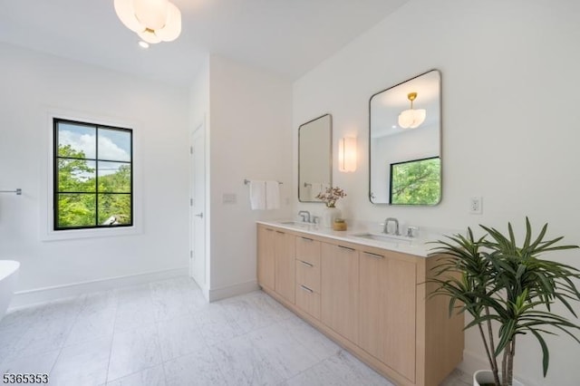 338 Old Short Hills Rd, Millburn Twp, NJ 07078 - full bathroom with double vanity, healthy amount of natural light, and a freestanding bath