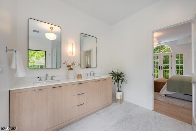 338 Old Short Hills Rd, Millburn Twp, NJ 07078 - full bathroom featuring french doors, double vanity, and ensuite bath