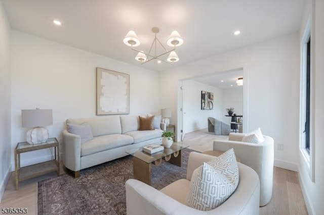 338 Old Short Hills Rd, Millburn Twp, NJ 07078 - living room with light wood finished floors, a chandelier, and recessed lighting