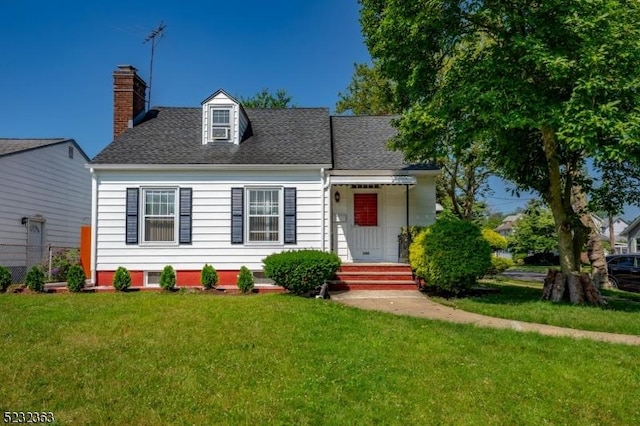 340 Hamilton St, Roselle Boro, NJ 07203 - cape cod house featuring a chimney, a front lawn, and roof with shingles