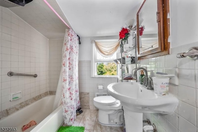340 Hamilton St, Roselle Boro, NJ 07203 - full bath with tile walls, tile patterned flooring, and shower / bath combo with shower curtain