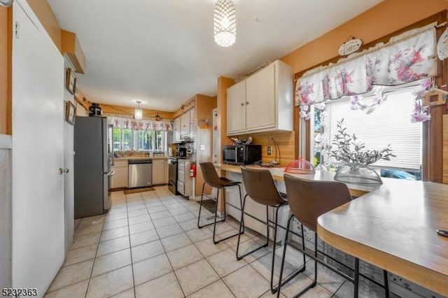 340 Hamilton St, Roselle Boro, NJ 07203 - kitchen with appliances with stainless steel finishes, light tile patterned flooring, and light countertops