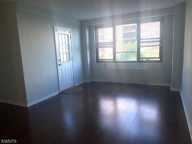 201 Saint Pauls Ave Unit 7M, Jersey City, NJ 07306 - unfurnished room featuring plenty of natural light and dark wood finished floors
