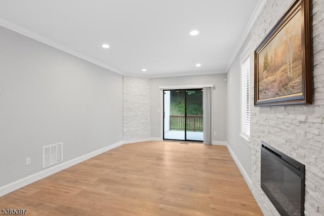 46 Overlook Dr Unit 46, Independence Twp, NJ 07840 - unfurnished living room with ornamental molding, a stone fireplace, light wood-style flooring, and recessed lighting