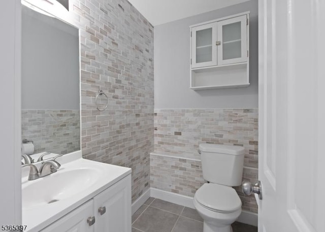 46 Overlook Dr Unit 46, Independence Twp, NJ 07840 - bathroom with tile walls, vanity, tile patterned flooring, and a wainscoted wall