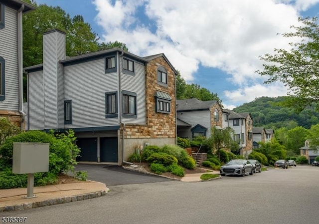46 Overlook Dr Unit 46, Independence Twp, NJ 07840 - view of property with an attached garage, driveway, and a residential view