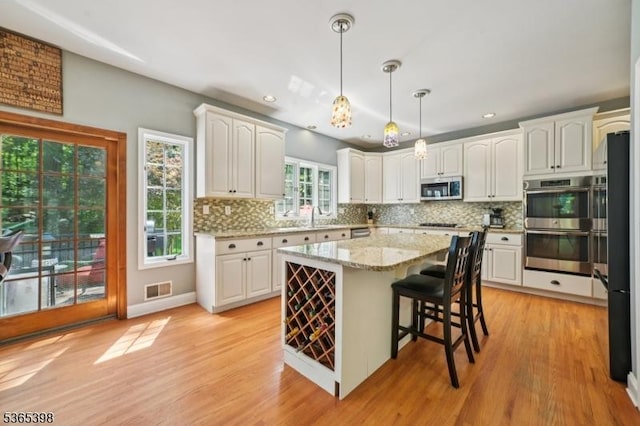 4 Knollwood Ter, Chester Twp, NJ 07930 - kitchen featuring stainless steel appliances, white cabinetry, tasteful backsplash, and recessed lighting