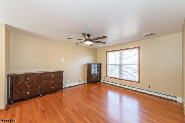 9 Hilary Ct, Vernon Twp, NJ 07460 - spare room with a baseboard radiator, wood finished floors, and ceiling fan