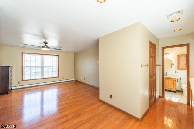 9 Hilary Ct, Vernon Twp, NJ 07460 - unfurnished room with light wood-type flooring, ceiling fan, and baseboard heating