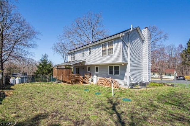 9 Hilary Ct, Vernon Twp, NJ 07460 - back of property with a chimney and a deck