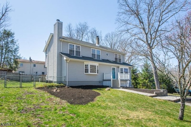 9 Hilary Ct, Vernon Twp, NJ 07460 - rear view of property with a chimney and a gate