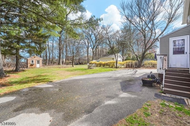 699 Riverview Dr, Totowa Boro, NJ 07512 - view of green lawn featuring an outdoor structure