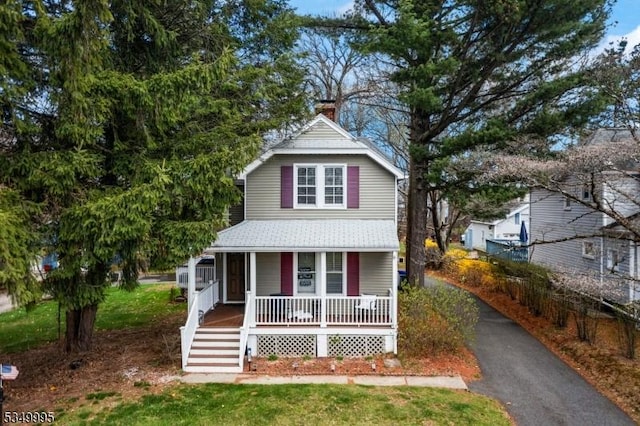 699 Riverview Dr, Totowa Boro, NJ 07512 - view of front of property with a porch, a chimney, a shingled roof, and stairway