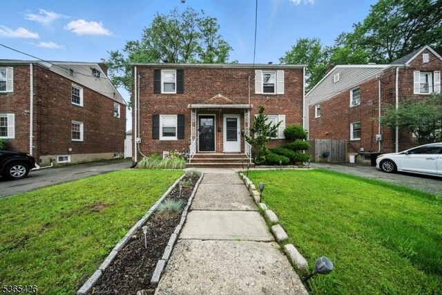 356 Raleigh Rd, Rahway City, NJ 07065 - view of front of house with brick siding