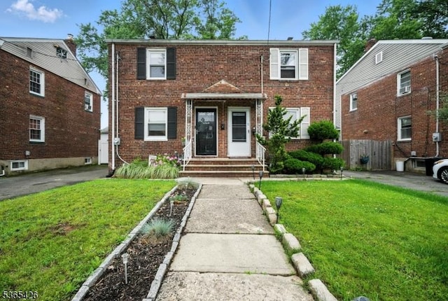 356 Raleigh Rd, Rahway City, NJ 07065 - townhome / multi-family property with brick siding and entry steps
