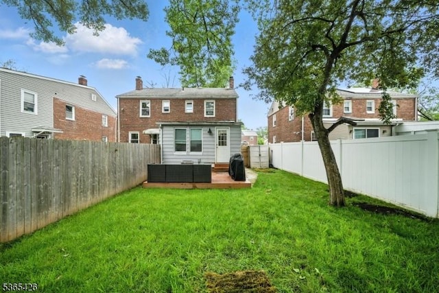 356 Raleigh Rd, Rahway City, NJ 07065 - rear view of property with an outdoor living space and a fenced backyard