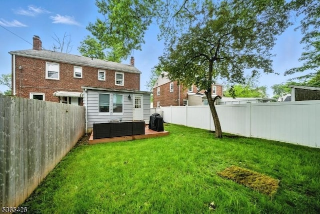 356 Raleigh Rd, Rahway City, NJ 07065 - back of house featuring a fenced backyard, a chimney, and an outdoor living space