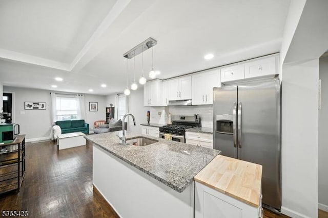356 Raleigh Rd, Rahway City, NJ 07065 - kitchen with stainless steel appliances, under cabinet range hood, white cabinets, recessed lighting, and a center island with sink