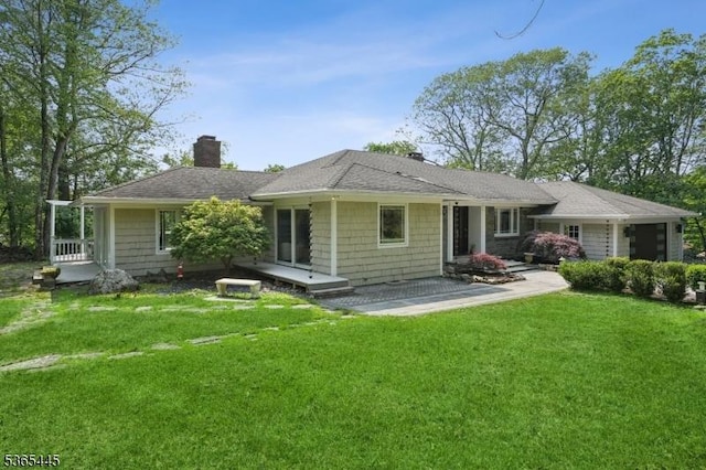 8 Hornbeam Ln, Kinnelon Boro, NJ 07405 - view of front of property with a chimney, a front lawn, and a shingled roof