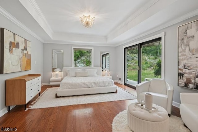8 Hornbeam Ln, Kinnelon Boro, NJ 07405 - bedroom featuring access to exterior, wood finished floors, a raised ceiling, a chandelier, and crown molding
