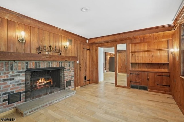 8 Hornbeam Ln, Kinnelon Boro, NJ 07405 - unfurnished living room with a fireplace, wood walls, and light wood-style flooring