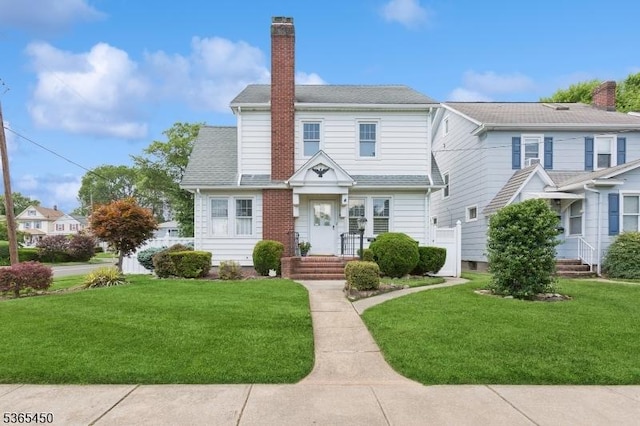 582 Pierson St, Westfield Town, NJ 07090 - view of front of home featuring a front lawn and a chimney