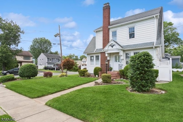 582 Pierson St, Westfield Town, NJ 07090 - view of front facade featuring a chimney, a front yard, and a residential view