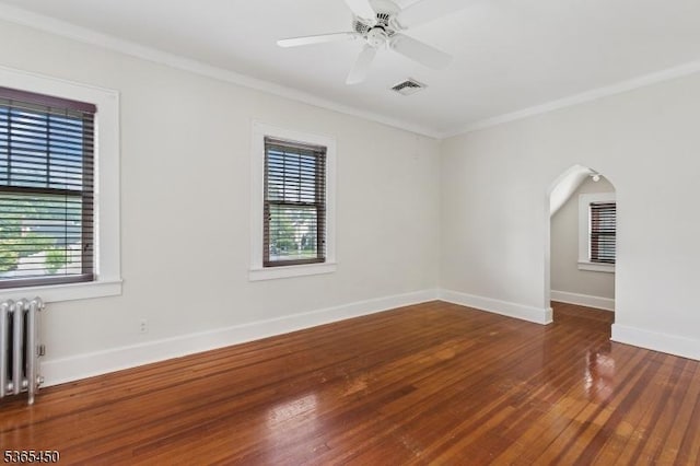 582 Pierson St, Westfield Town, NJ 07090 - unfurnished room featuring radiator, ornamental molding, plenty of natural light, hardwood / wood-style floors, and arched walkways