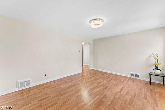 587 Jesse Pl, Union Twp, NJ 07083 - spare room featuring arched walkways and light wood-type flooring
