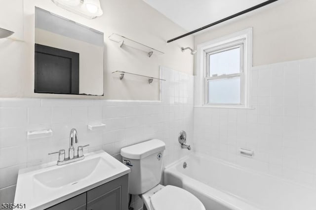 587 Jesse Pl, Union Twp, NJ 07083 - full bathroom with tile walls, vanity, tub / shower combination, and wainscoting