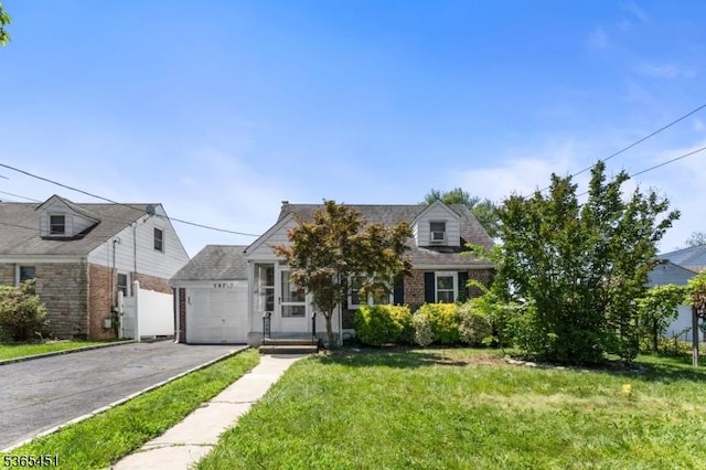587 Jesse Pl, Union Twp, NJ 07083 - view of front of home featuring a front lawn, driveway, a garage, and brick siding