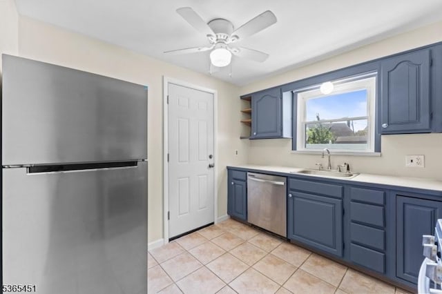 587 Jesse Pl, Union Twp, NJ 07083 - kitchen with appliances with stainless steel finishes, blue cabinets, open shelves, light tile patterned floors, and a ceiling fan