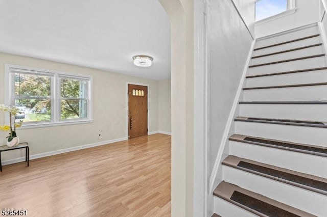 587 Jesse Pl, Union Twp, NJ 07083 - entryway featuring light wood-style flooring, stairs, and arched walkways