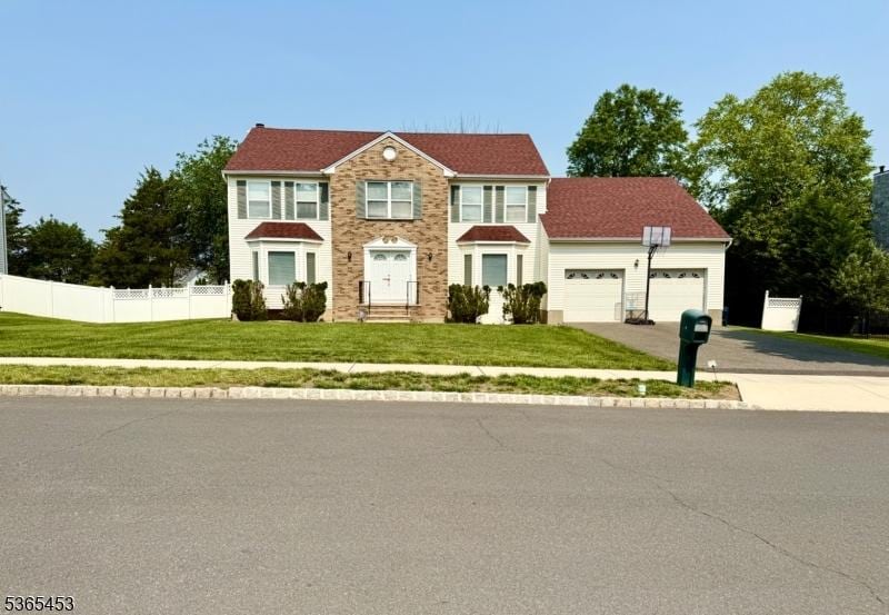 5 Angela Ct, Piscataway Twp, NJ 08854 - view of front of home with driveway and a garage