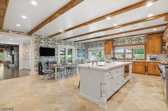 119 Mosle Rd, Mendham Twp, NJ 07945 - kitchen featuring light countertops, healthy amount of natural light, recessed lighting, an island with sink, and beamed ceiling