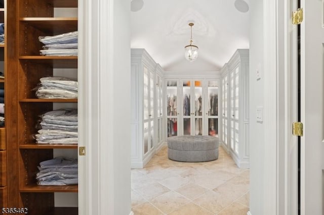 119 Mosle Rd, Mendham Twp, NJ 07945 - spacious closet featuring tile patterned flooring, a chandelier, and vaulted ceiling
