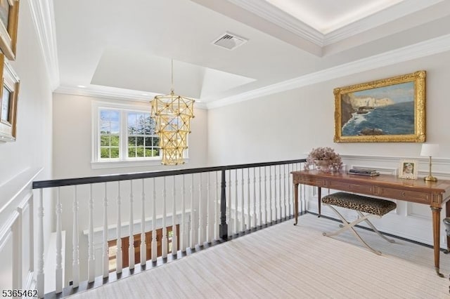 119 Mosle Rd, Mendham Twp, NJ 07945 - hallway featuring a chandelier, a raised ceiling, crown molding, an upstairs landing, and a decorative wall