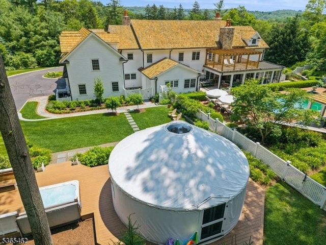 119 Mosle Rd, Mendham Twp, NJ 07945 - rear view of property with a fenced backyard, a jacuzzi, and a chimney