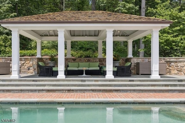 119 Mosle Rd, Mendham Twp, NJ 07945 - view of pool featuring an outdoor living space, a gazebo, and view of wooded area