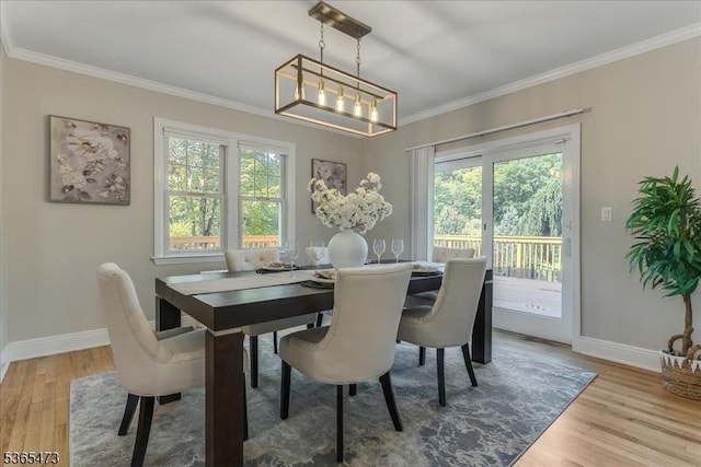 162 N Maple Ave, Bernards Twp, NJ 07920 - dining space featuring ornamental molding, wood finished floors, and a chandelier