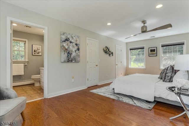 162 N Maple Ave, Bernards Twp, NJ 07920 - bedroom featuring a baseboard radiator, multiple windows, recessed lighting, ensuite bath, and wood finished floors