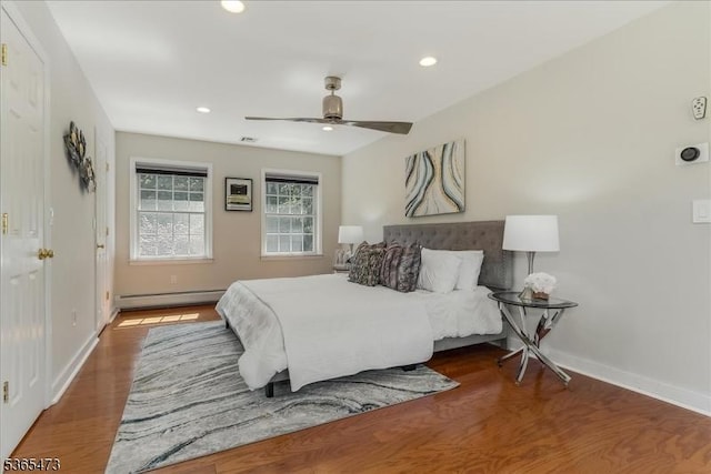 162 N Maple Ave, Bernards Twp, NJ 07920 - bedroom with baseboard heating, wood finished floors, recessed lighting, and a ceiling fan