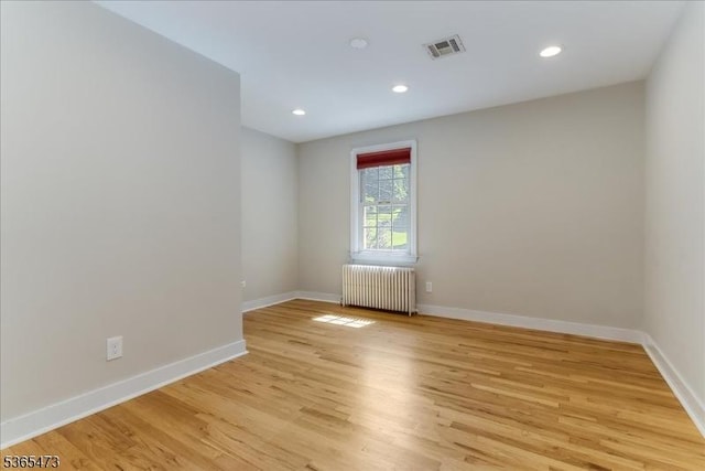 162 N Maple Ave, Bernards Twp, NJ 07920 - unfurnished room featuring radiator, light wood-type flooring, and recessed lighting