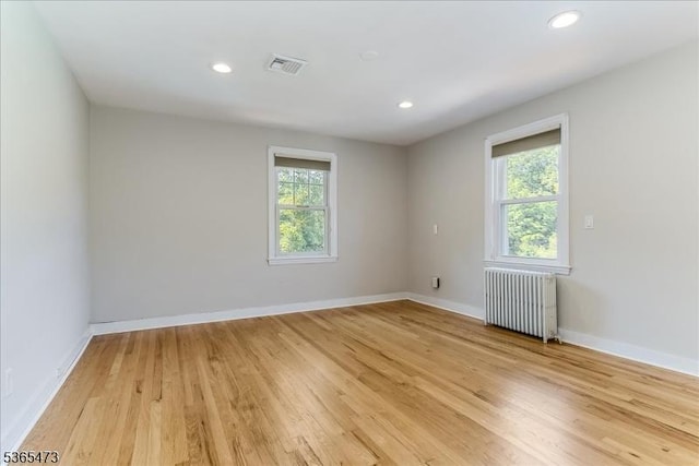162 N Maple Ave, Bernards Twp, NJ 07920 - unfurnished room featuring radiator, plenty of natural light, light wood-type flooring, and recessed lighting