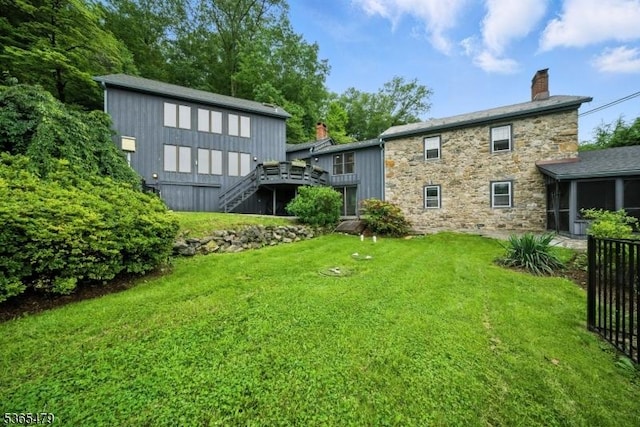 182 Musconetcong River Rd, Lebanon Twp, NJ 07882 - rear view of house with a chimney, stone siding, a yard, a sunroom, and stairs