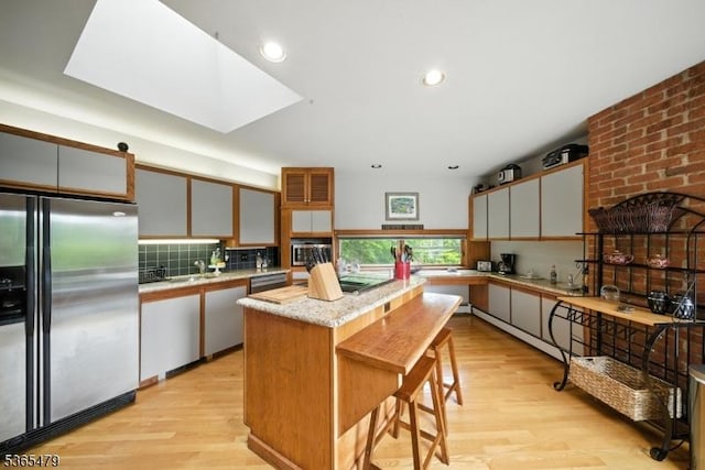 182 Musconetcong River Rd, Lebanon Twp, NJ 07882 - kitchen with stainless steel appliances, a center island, light wood-style flooring, backsplash, and recessed lighting