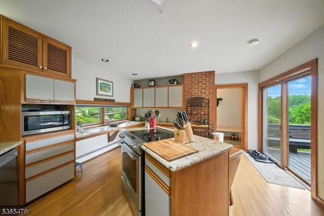182 Musconetcong River Rd, Lebanon Twp, NJ 07882 - kitchen featuring appliances with stainless steel finishes, light wood finished floors, healthy amount of natural light, a kitchen island, and recessed lighting