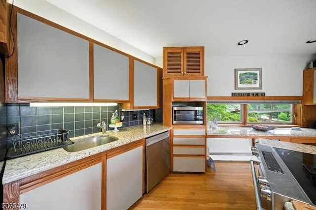 182 Musconetcong River Rd, Lebanon Twp, NJ 07882 - kitchen featuring stainless steel appliances, decorative backsplash, light wood finished floors, light stone countertops, and recessed lighting